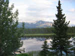 The view across the small lake at the kennel.  The dogs jump in after a run, and it's a good, low impact workout for the dogs.