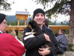 You get to hold a puppy when you arrive.  They do this to socialize the pups.