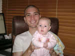 Hangin' out with dad, July 2008.  She's got him wrapped around her little finger and in the palm of her hand, all at once!