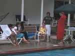 The cousins around the pool