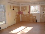 Same shot - everything is gone. The white oak flooring has been laid.  It looks wonderful.  The room looks so much bigger without the soffit.