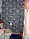 This is, by far, the busiest wallpaper in the world.  The powder room on the first floor.