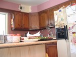 The "right" side of the old kitchen.  The previous owner loved pink - think rubber glove pink - I'm so glad it's gone.