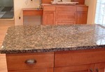 The granite is in - it's awesome.  It's 3cm Baltic Brown, from Finland, and it's between 540 million and 2.5 billion years old.