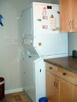 Remodeled laundry room. Maytag Neptune W/D, porcelain tile floor, base and wall cabinets, Formica "Colorado Slate" counter.  The W/D sits on a set of appliance rollers, so moves easily away from the wall. And, finally, I was able to display Elvis.