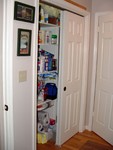 Pantry.  Same as the "old" pantry.  5' wide, 2' deep.  I added a light, the wood floor was also installed into the pantry. The shelves are a little deeper.  I removed the bifold doors and added sliding doors - it works much better now.
