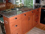 Peninsula with drawers and cabinets.  In order to have a seating area, the cabinets and drawers on the end are only about 9" deep.  I thought that would be a problem, but it turns out they are perfect for storing pots and pans and small appliances like the mini processor, hand mixer, and Handy Mixer.