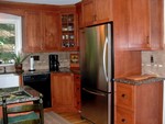 Right side of the kitchen.  I've since gotten a new refrigerator door, it opens the other way.  What was I thinking.