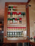 Spice rack inside cupboard door.  The shelves are a little narrower so the door can close.  I really like the arrangement.